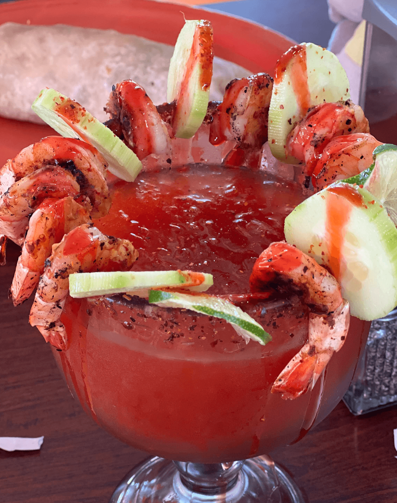 Michelada cocktail garnished with seasoned shrimp at Roberta's Cocina Mexicana Sacramento
